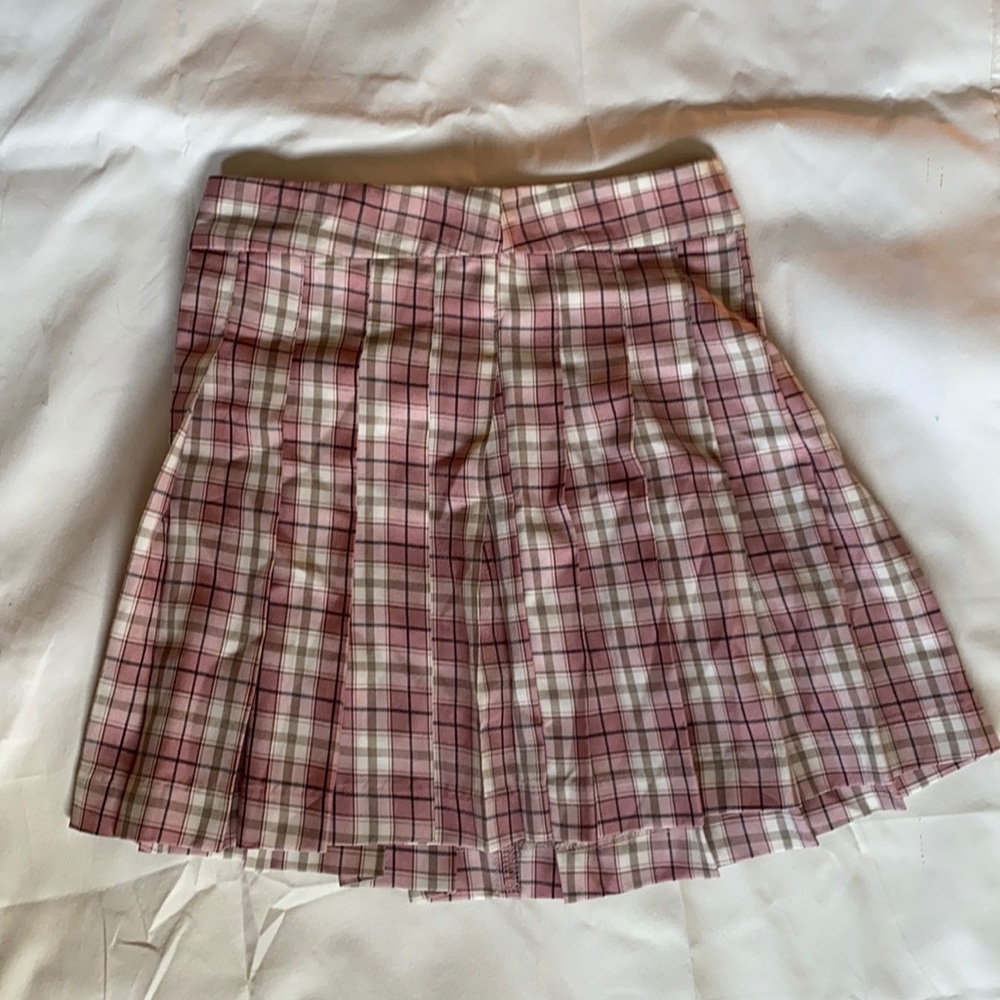 Pink plaid tennis skirt from princess Polly